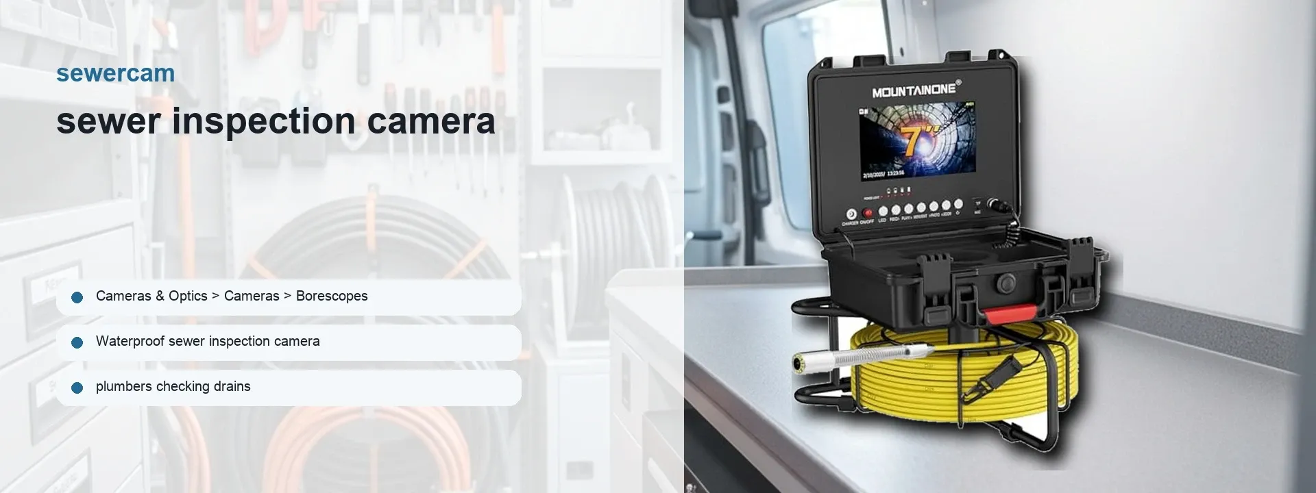 Sewer inspection camera kit with monitor, yellow cable reel and probe camera head displayed on a van work surface.